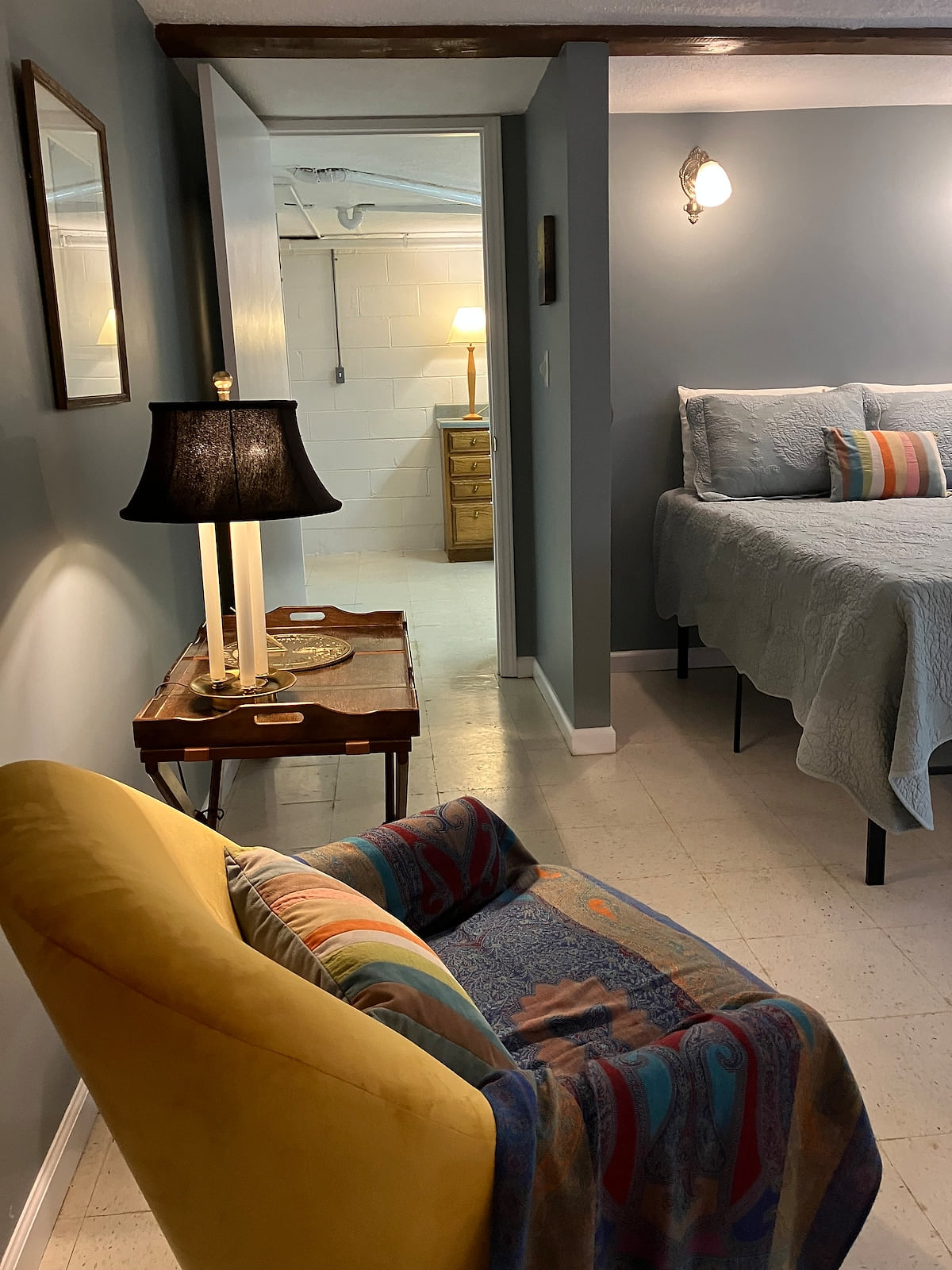 Various bed treatments are rotated on a seasonal basis throughout the year.  Hence, you will see different bed treatments in the Listing photographs.  This picture reflects the hallway from the bedroom/dining/occasional seating area to the bathroom.