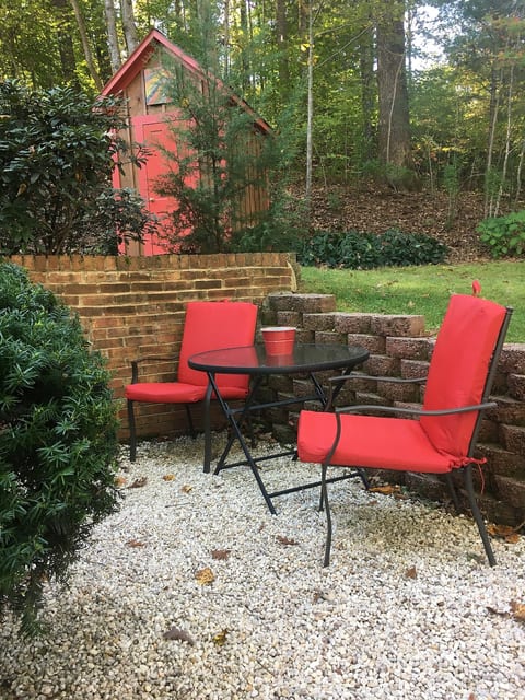 Walk across front lawn to private entrance. There are 2 steps to the first pebbled area pictured here & then 2 steps down to the entrance landing.