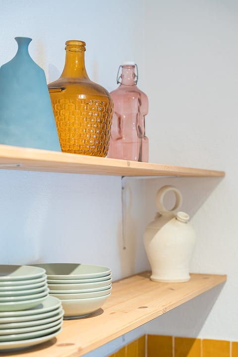 Stylish open shelves with curated decor and ready-to-use dishware