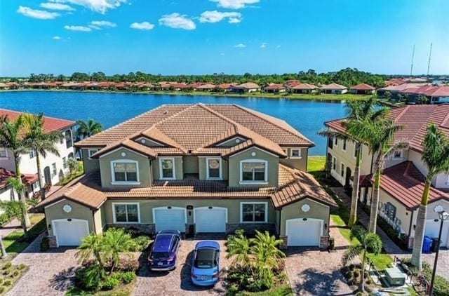 Carriage homes, four to a building.  Ours is bottom right with light blue car in driveway/garage area.  