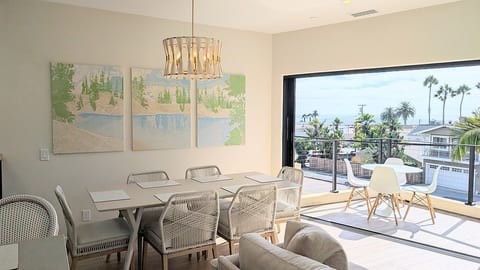 West Elm dining table seats 6 comfortably (plus you can squeeze 2 more on the ends using patio chairs if needed)