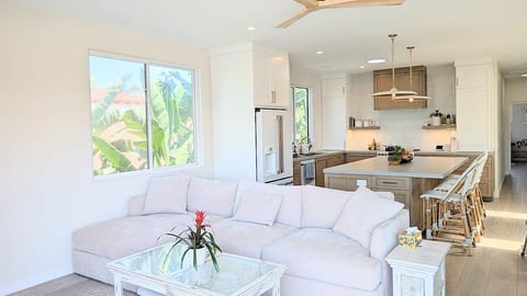 Open floor plan with comfortable couch for movie nights
