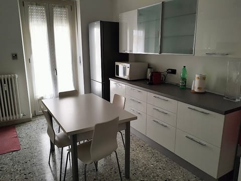 Fully equipped eat-in kitchen with dining table for 6 people. You will find: refrigerator, oven, microwave, dishwasher, kettle, toaster, moka coffee maker and pod coffee machine. Balcony available. TV.