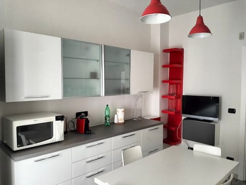 Fully equipped eat-in kitchen with dining table for 6 people. You will find: refrigerator, oven, microwave, dishwasher, kettle, toaster, moka coffee maker and pod coffee machine. Balcony available. TV.