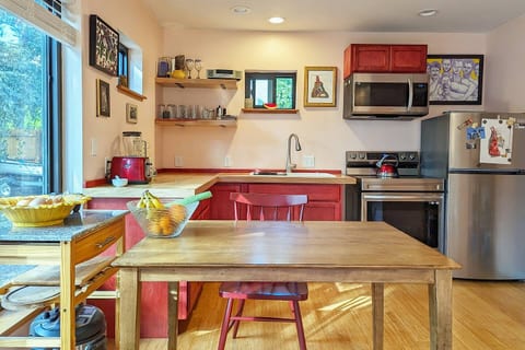A cheerful blend of wood and crimson, where meals are shared, and moments become memories.