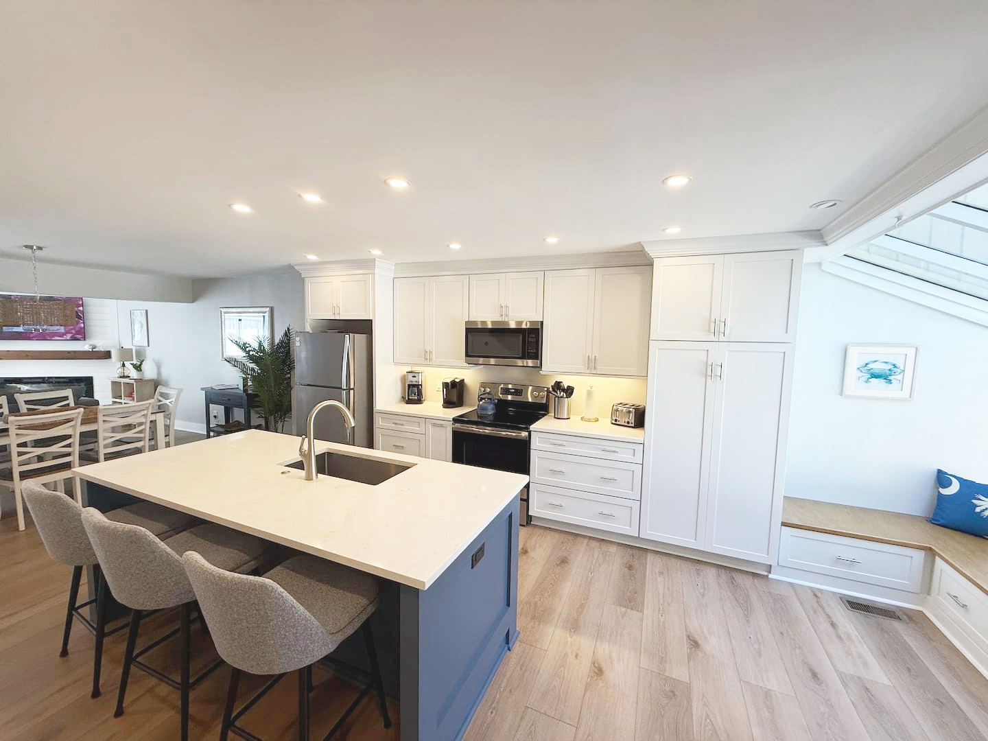 Upon entering, you are welcomed into our newly renovated kitchen and open-concept first floor. Enjoy the sunny atrium with built-in window seats. Quartz countertops, full-size pantry, and upgraded cabinets adorn this fully appointed-kitchen.