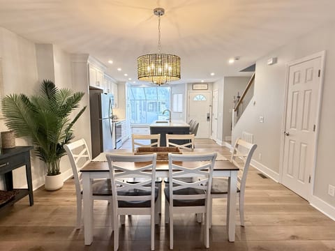 The dining room features a new table with seating for six. Beyond dining, the room is perfect for games and family fun. Comfortable seating for three is available at the kitchen island.