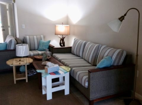 The lamps in the living room provide additional lighting, which is perfect for reading!