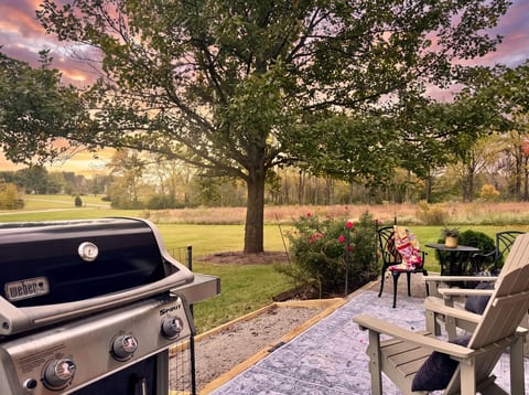 Dedicated grill and patio seating area with bistro table