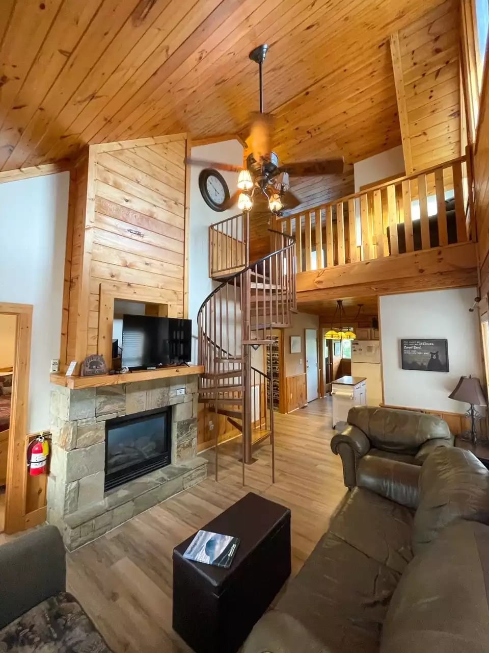 Main Level Living Room with TV and Fireplace