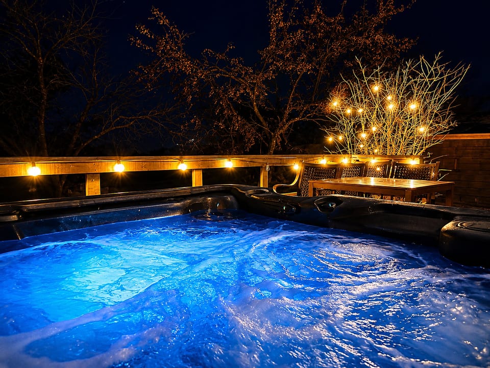 Private hot tub with glowing lights for cozy evenings on the deck