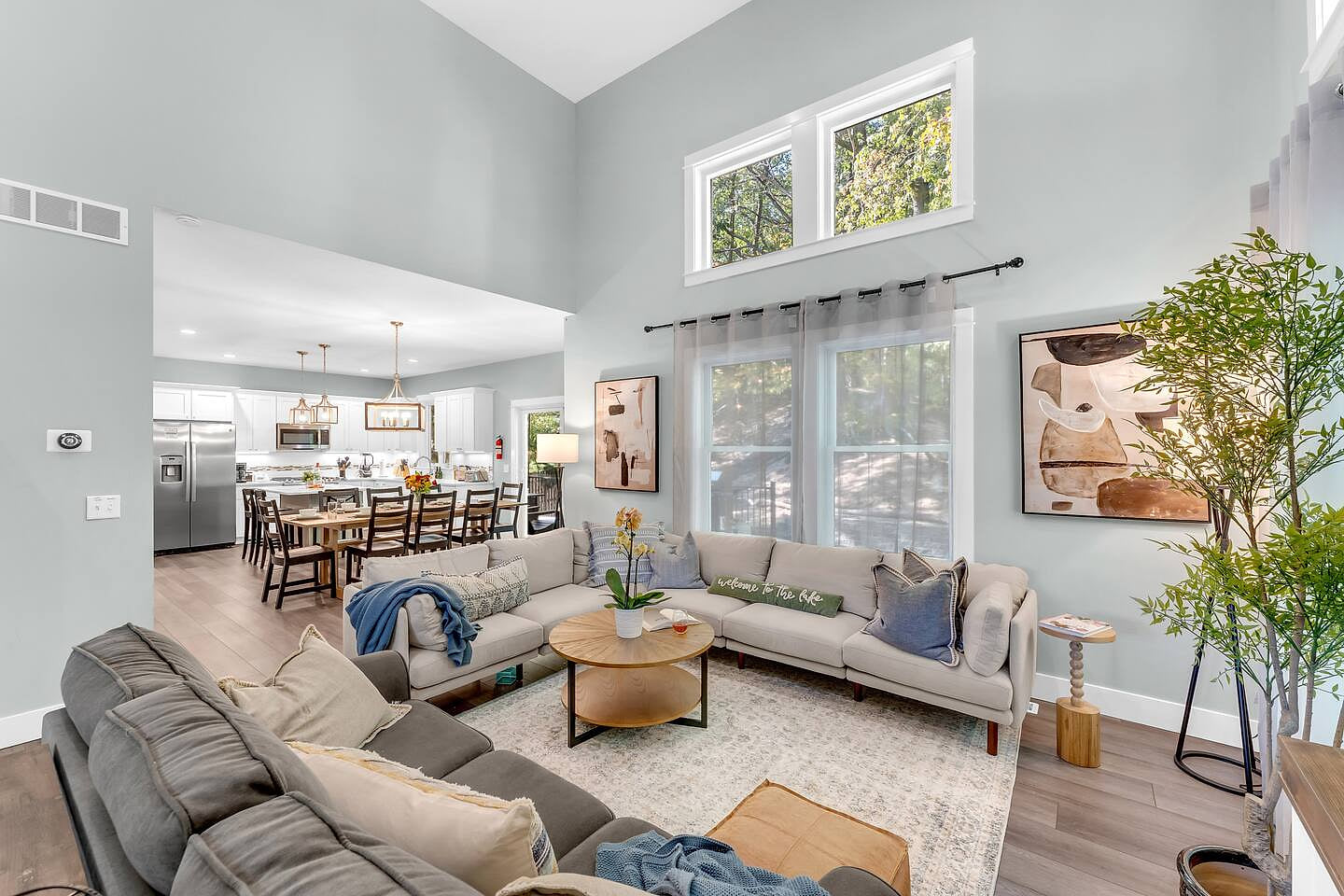 Experience seamless flow in this open-concept home, where the cozy living room connects to the spacious dining area and modern kitchen.