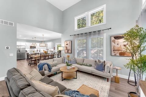 Experience seamless flow in this open-concept home, where the cozy living room connects to the spacious dining area and modern kitchen.