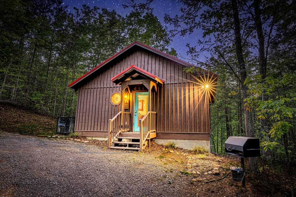 Cozy forest cabin with starry skies, warm porch, and outdoor grill