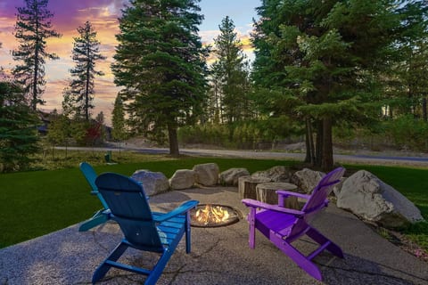 Outdoor fire pit surrounded by the pines