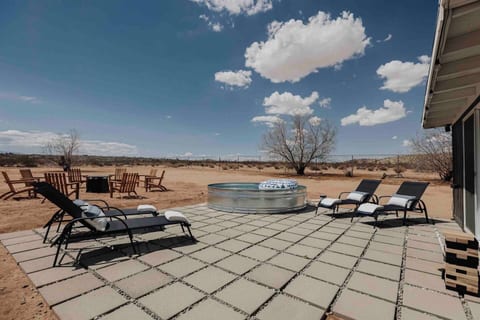 Immerse yourself in the serene desert atmosphere of our outdoor lounge, perfect for unwinding after a long day of exploring.