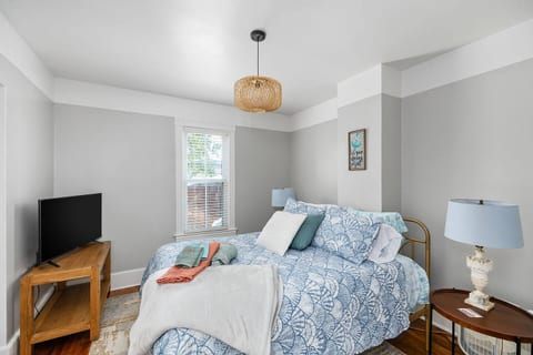 First floor primary bedroom with Queen bed and ensuite bathroom.