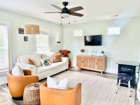 Upstairs living room with smart tv and pull out couch.