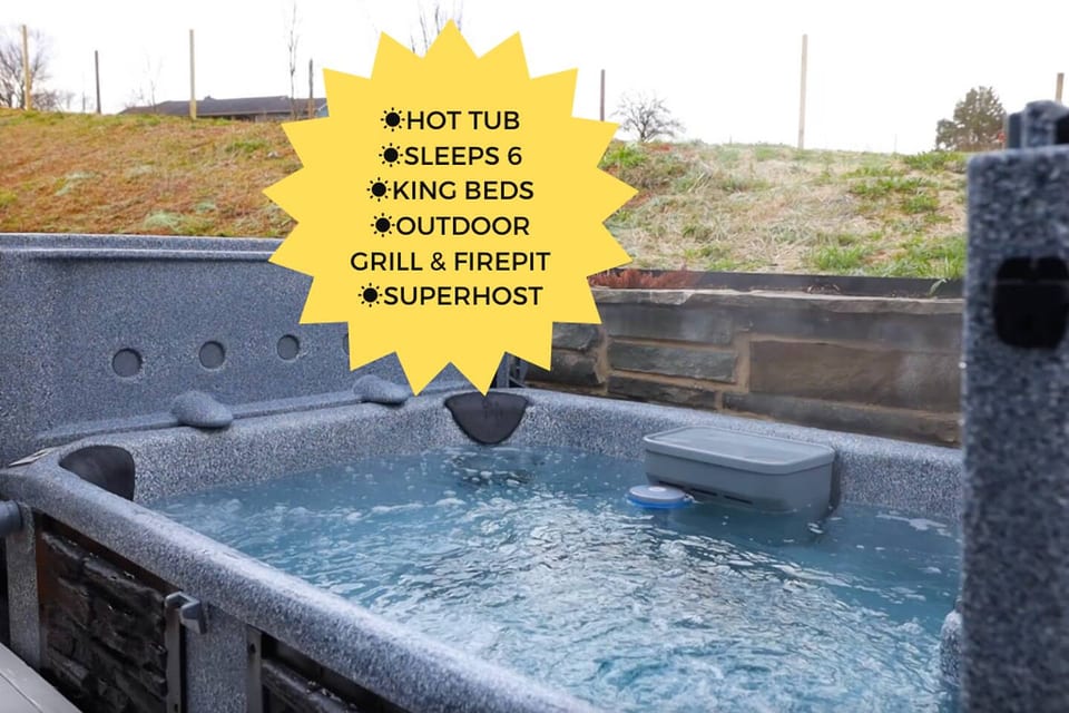 Hot tub with temperature control, lights, and jets. Hard cover top provides privacy.