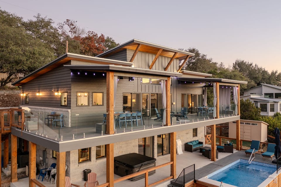 Highlights: 5 bedrooms [3 kings, queen over queen bunk, 2 twin XL bunks] | 3 full baths | 1 half bath | pool | hot tub | lakeviews | wrap-around deck | arcade | pool/billiards table | ping-pong table