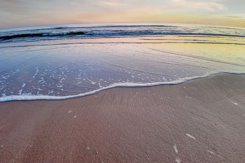 Sunrise at the beach across from condo building.  