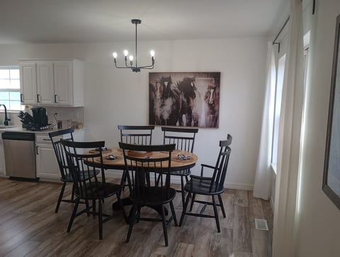 Light and bright dining area, open to both the kitchen and living areas, seats 6 comfortably.