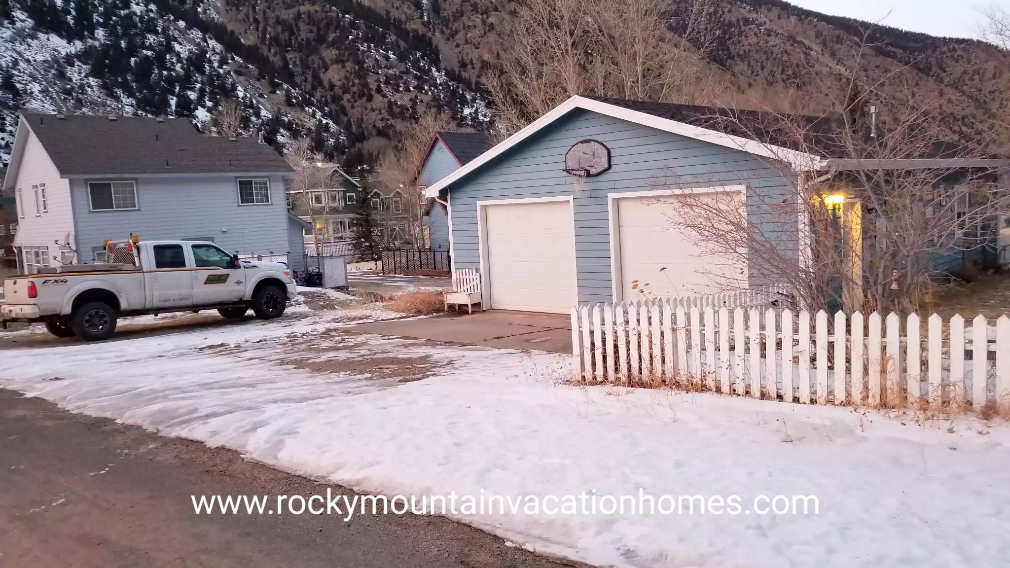 There are 3 dedicated parking spaces. One in front of each garage door and one just to the left of the garage. 
