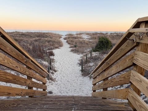 Follow the boardwalk through the dunes and let the day slow down. Your toes-in-the-sand moment is just ahead. Our condo is just steps to the beach!
