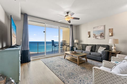 Spacious open-concept layout connecting kitchen, dining, and living areas with stunning water views.
