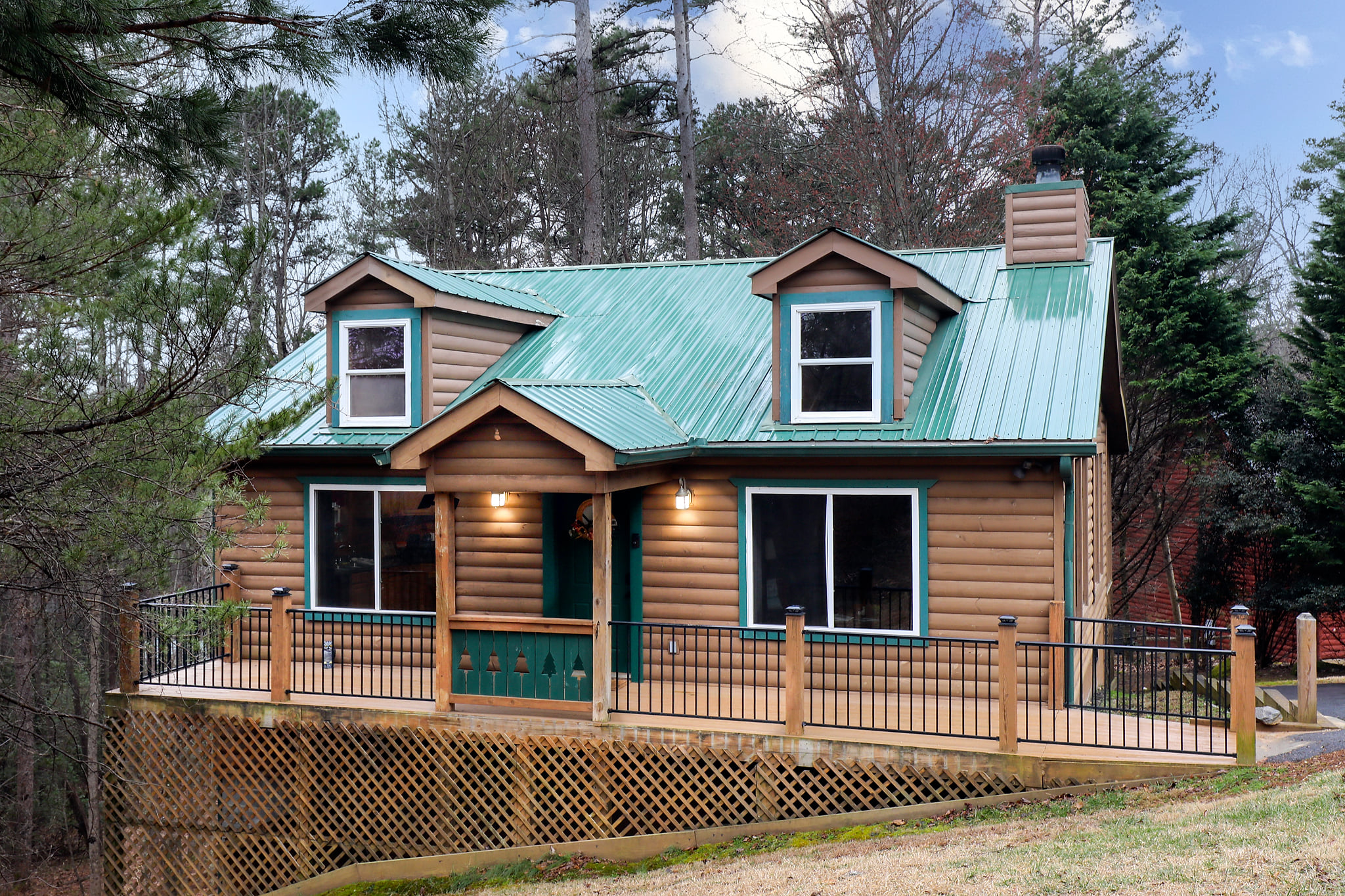 Cozy log cabin with wraparound deck and forest views—peaceful escape