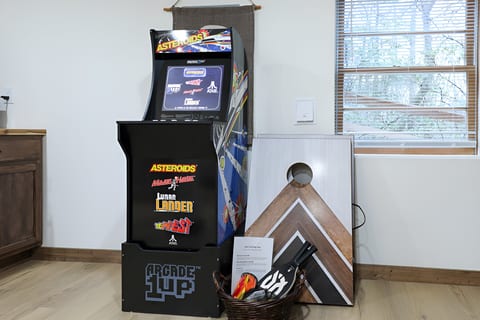 Retro arcade + cornhole game corner—rain-or-shine entertainment.