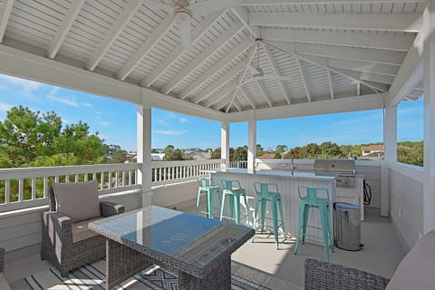 What sets this home apart: Rooftop deck with outdoor kitchen, bar and lounge area. The perfect place to enjoy 360 degree views, gulf breezes and epic sunsets!