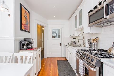 Kitchen with in-unit washer & dryer in the laundry closet