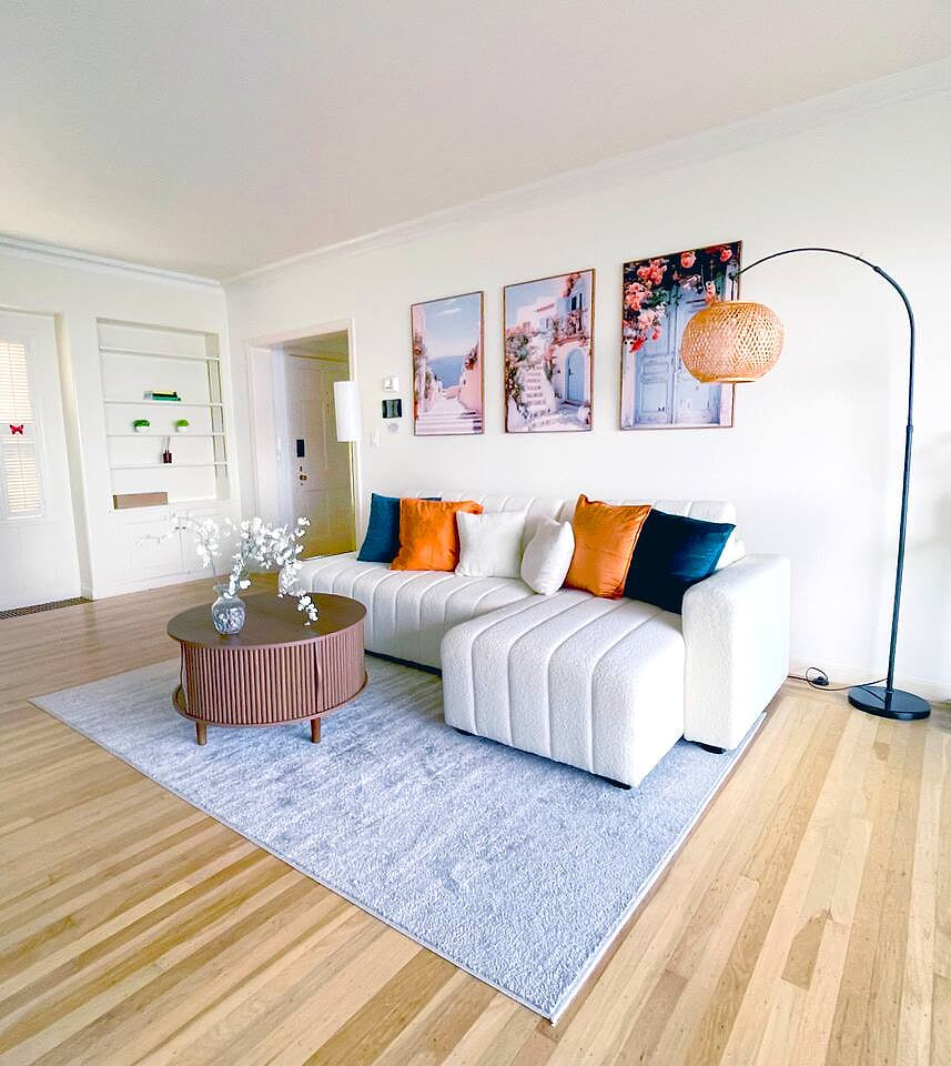 Bright, stylish living room with plush seating, vibrant decor, and a cozy vibe—perfect for relaxing after a day of exploring the Bay Area.