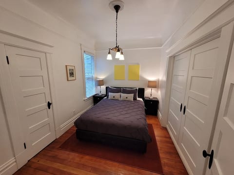 Comfy first bedroom with a queen bed