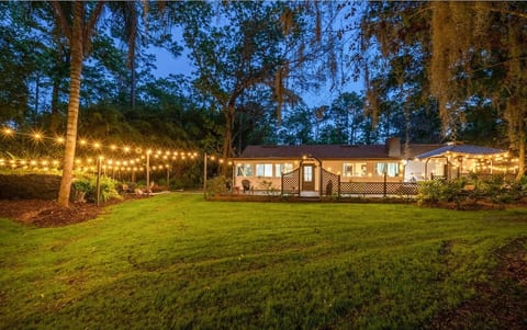 At night, turn on the string lights and watch the entire back of the Property light up like stars! Back deck, firepit and around the back yard so you can play games, enjoy a nice beverage, the hot tub, and the sound of nature.