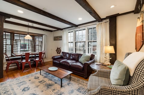 Living Room: Sunlight dances through windows, inviting relaxation in stylish comfort and charm!