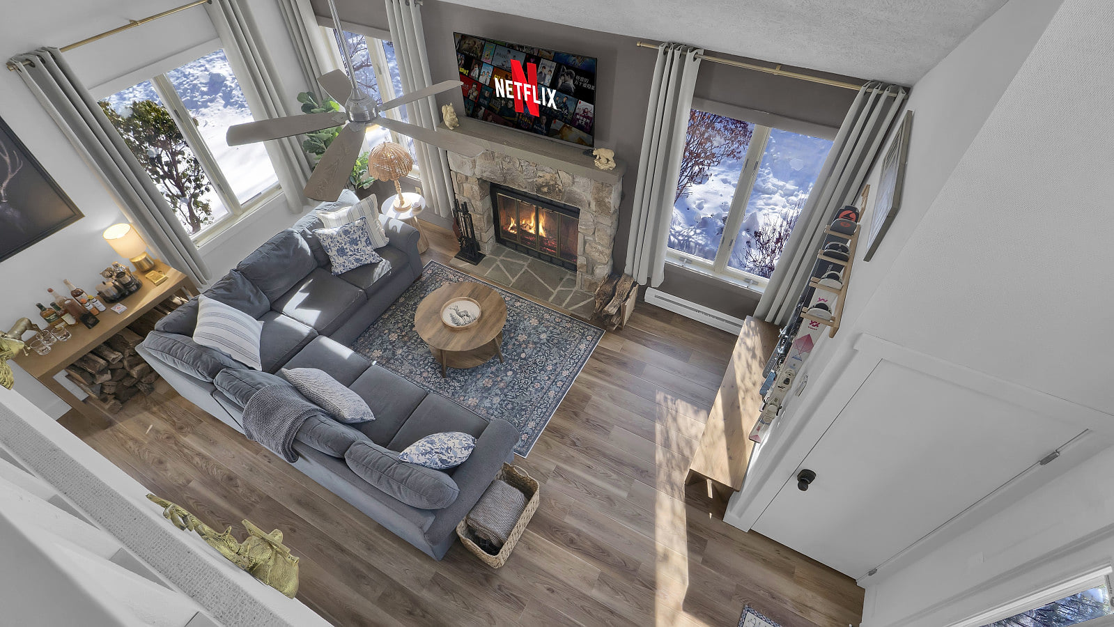 A stunning view of the cozy living room from the loft, where comfort and style meet for a perfect hangout spot.