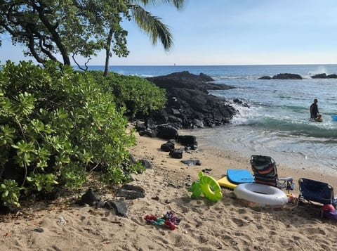 Turtle Beach, right across the street. You will traverse over rocks to the north and you will find Turtle Beach which is a secret beach in Kona.