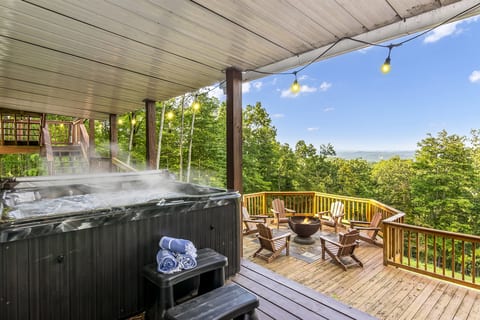 Hot tub overlooking the fire pit and year round mtn views