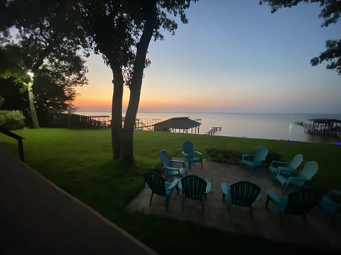 Private deck with outdoor furniture and bay views at Bayfront Bliss Gulf Breeze pet-friendly waterfront vacation home