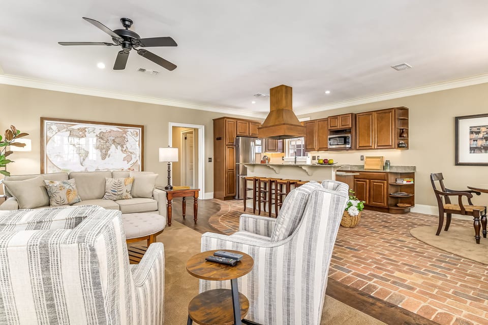 Open-concept living with Chicago brick floors - walk to Seville Square and Palafox Street
