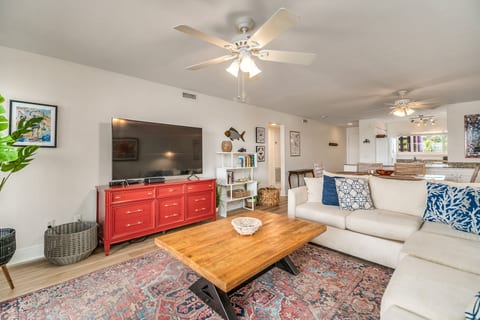 Bright open living room with balcony access and river views at Perdido Key waterfront condo