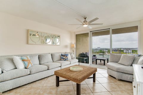 Living room with comfortable seating and Old River views at Wind Drift Orange Beach vacation condo