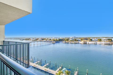 Sunset views from covered patio at Wind Drift Bayside N Orange Beach dual-waterfront vacation rental on Alabama coast