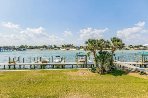 Direct river access for boats and kayaks at Wind Drift Orange Beach bayfront vacation rental near Flora-Bama