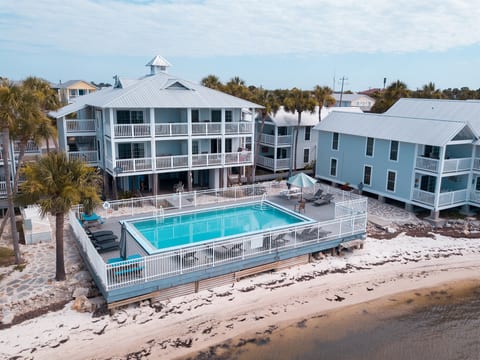 Enjoy the pool or lounge down on the sand by the Gulf