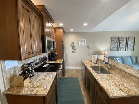 Beautifully decorated kitchen with granite countertops.