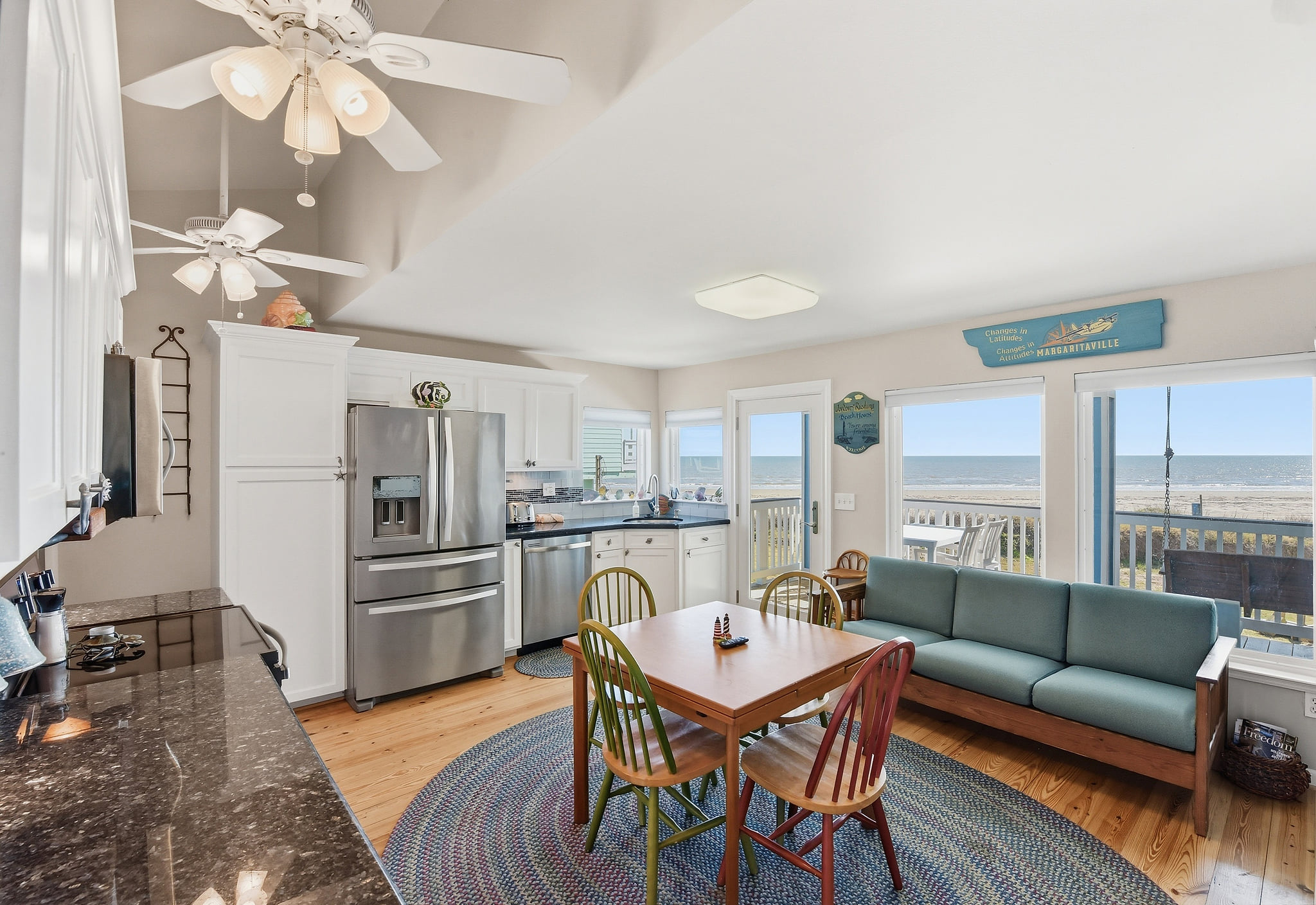 Sunny beachside kitchen-living with ocean views and deck access