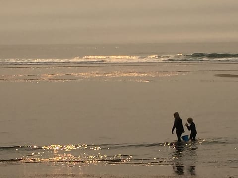 Our two oldest children playing in the surf. 